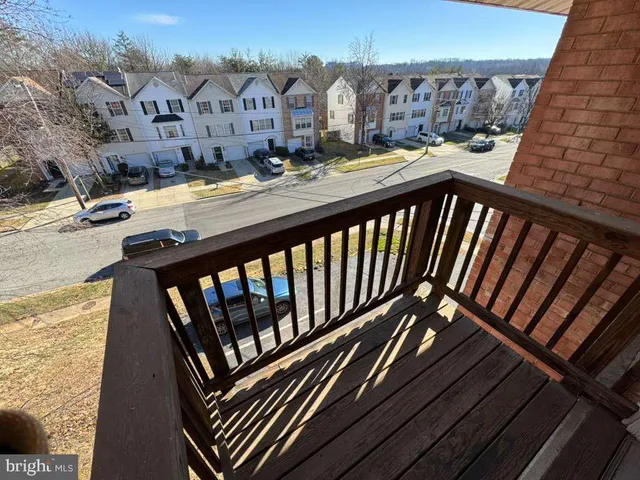 a view of a balcony with two chairs and a table