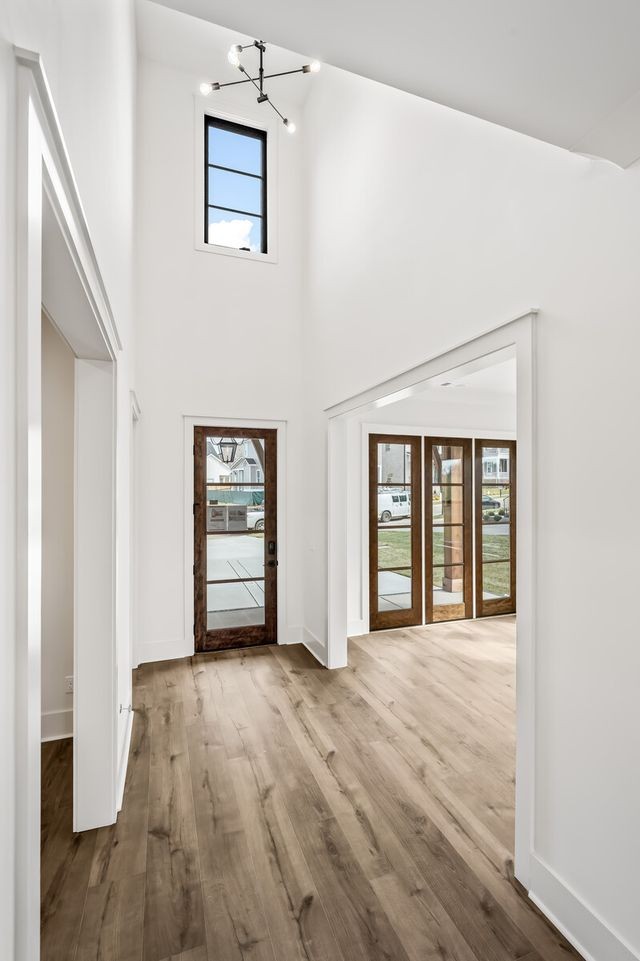 5133 Rambler Loop Franklin, TN 37064 - Photo 11 of 20 an empty room with wooden floor and windows