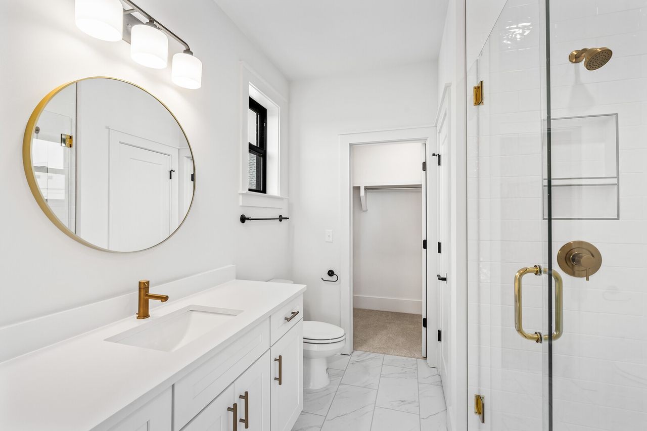 5133 Rambler Loop Franklin, TN 37064 - Photo 18 of 20 a bathroom with a sink a toilet and a mirror