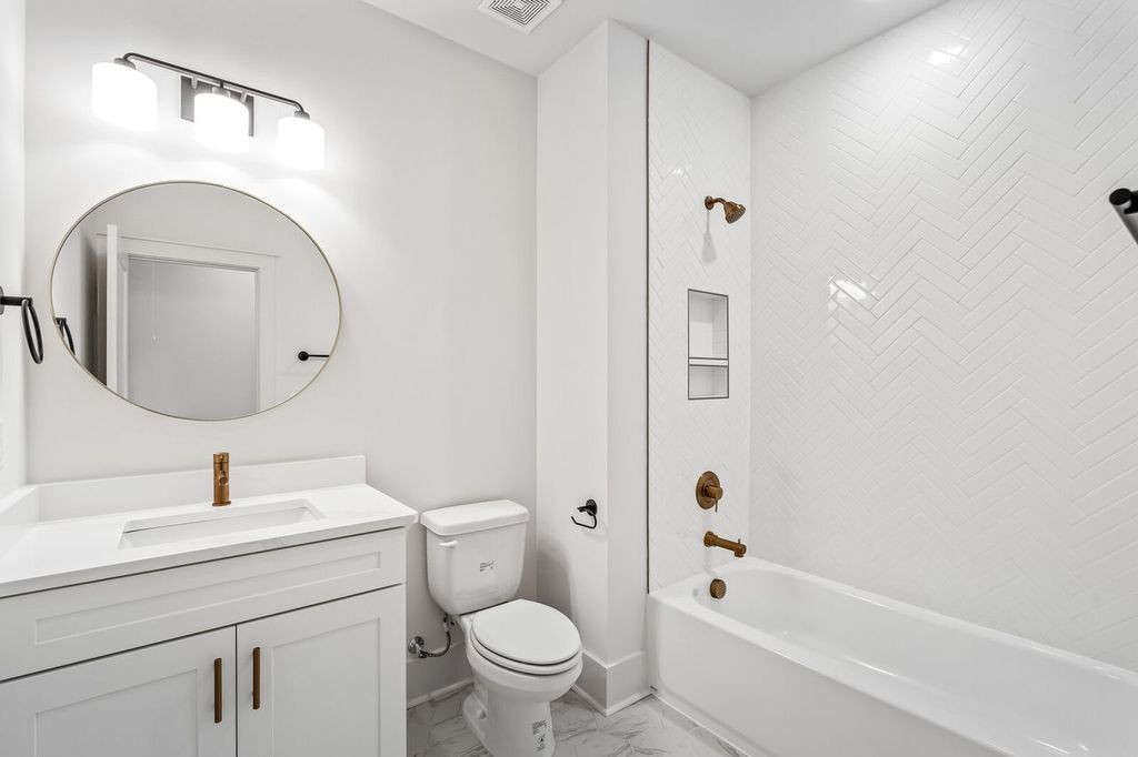 5133 Rambler Loop Franklin, TN 37064 - Photo 20 of 20 a bathroom with a toilet sink and mirror