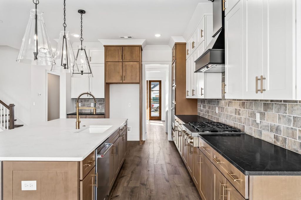 5133 Rambler Loop Franklin, TN 37064 - Photo 8 of 20 a kitchen with stainless steel appliances a sink stove and refrigerator