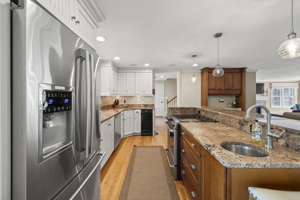 30 Franklin Rodgers Road Hingham, MA 02043 - Photo 6 of 37 a kitchen with granite countertop a sink counter top space appliances and cabinets