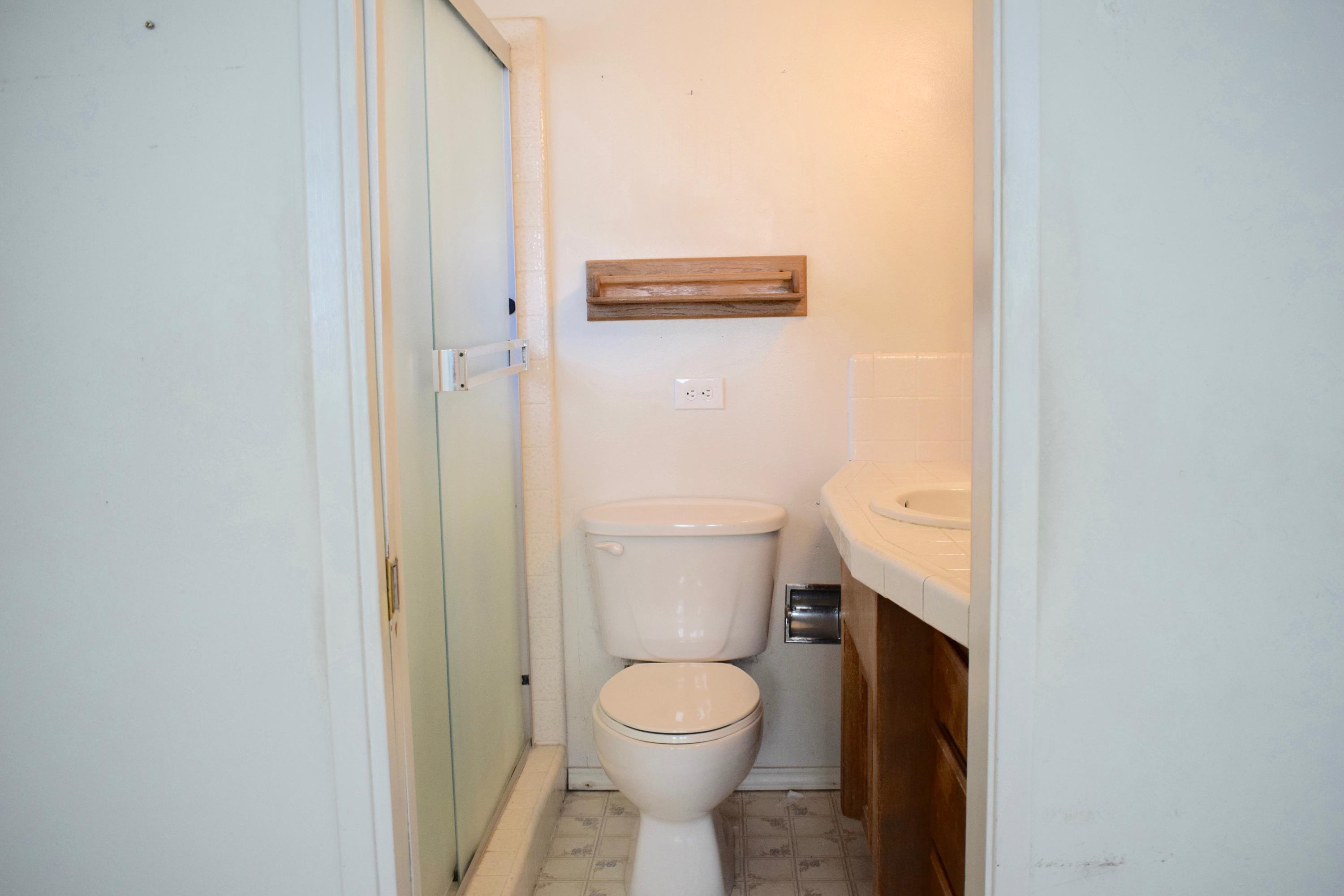 8585 Redbank Road Redding, CA 96001 - Photo 17 of 37 a bathroom with a toilet and a sink