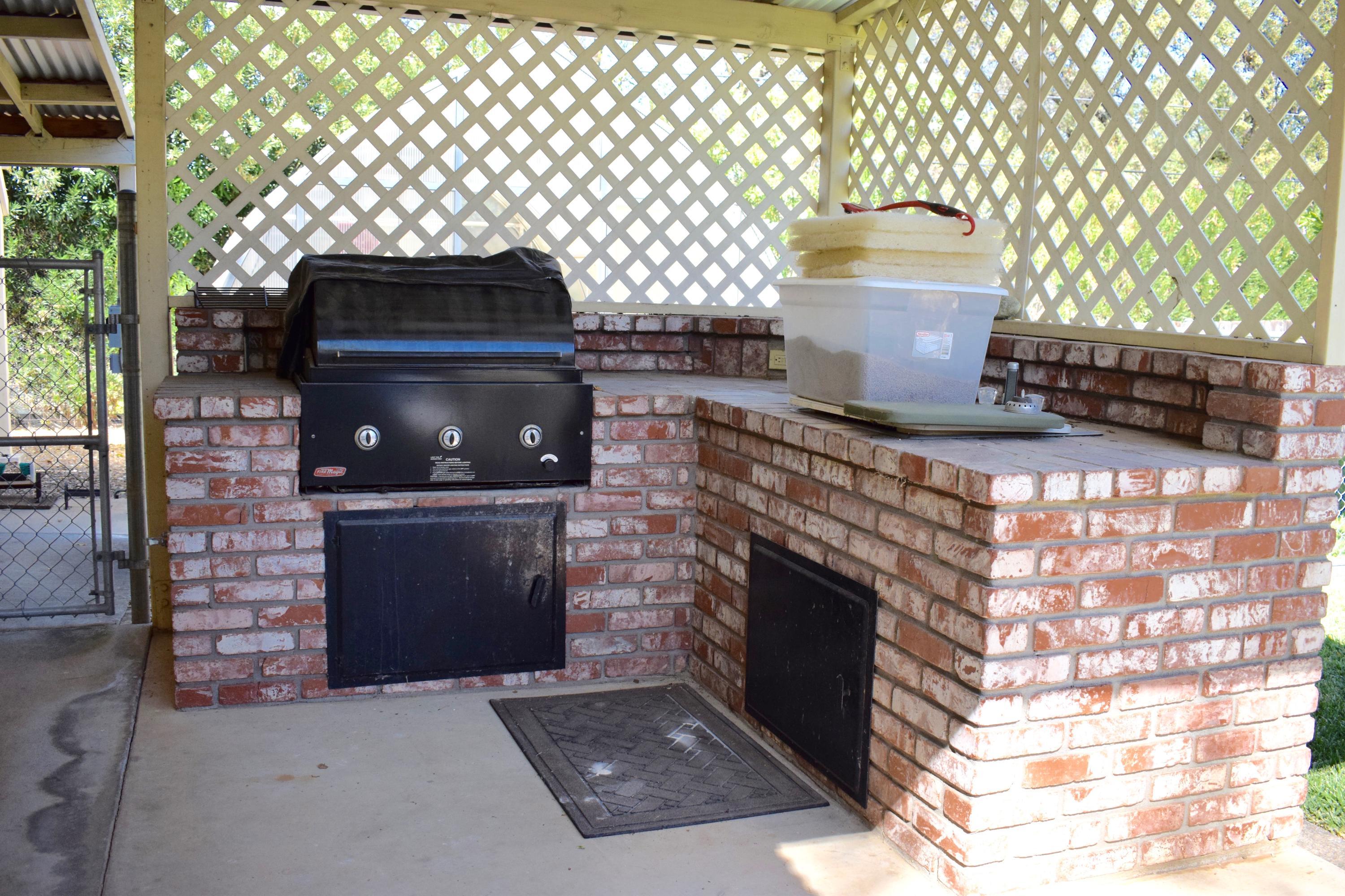 8585 Redbank Road Redding, CA 96001 - Photo 24 of 37 a stove top oven sitting inside of a kitchen