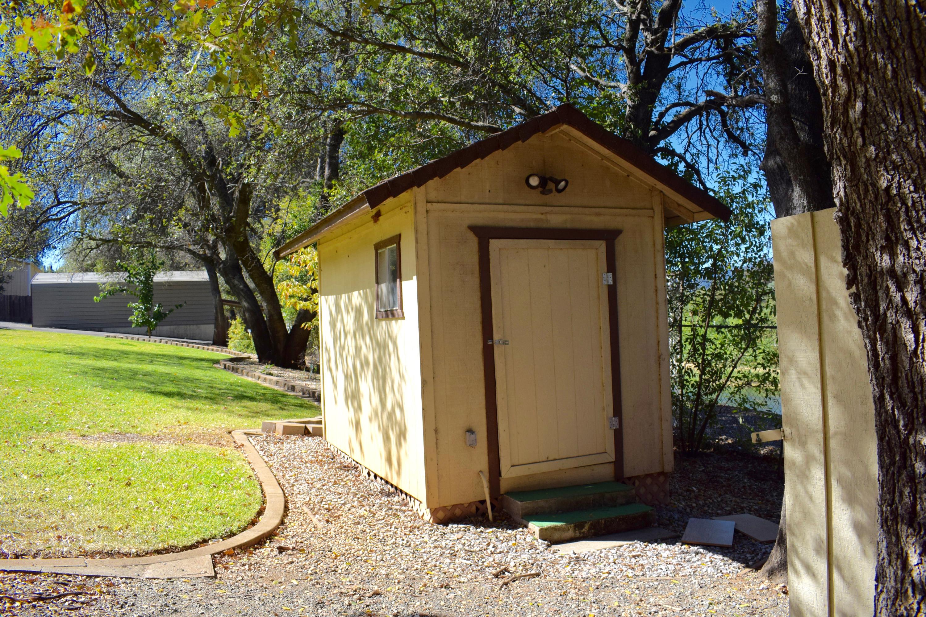 8585 Redbank Road Redding, CA 96001 - Photo 35 of 37 a front view of a house with a yard