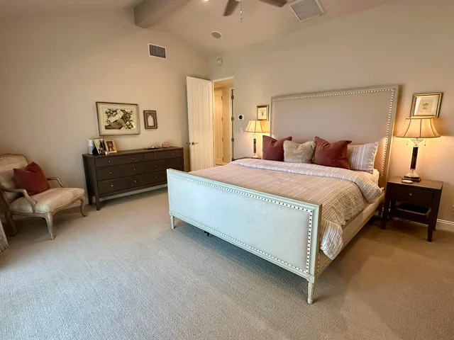 a bathroom with a granite countertop sink a toilet and mirror
