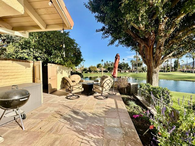 a view of a chairs and tables in the patio