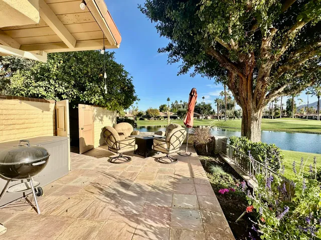 a view of a chairs and tables in the patio