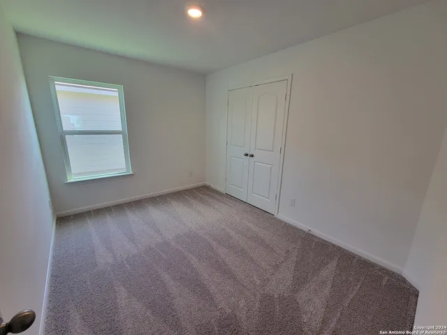 a view of a room that has a window in it