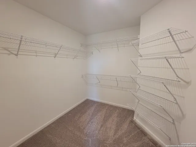 a view of a room with racks on the wall