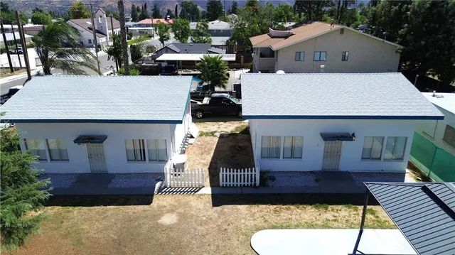 an aerial view of a house with yard