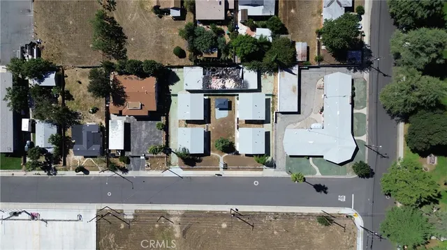 an aerial view of residential houses with outdoor space