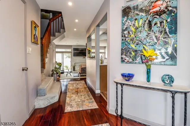 a view of a hallway to a livingroom and furniture