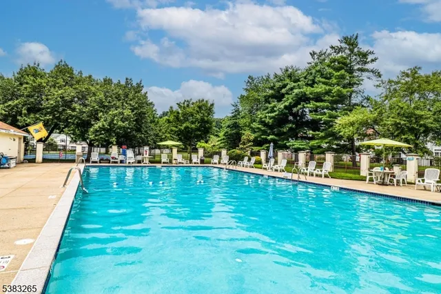 a view of swimming pool with a yard