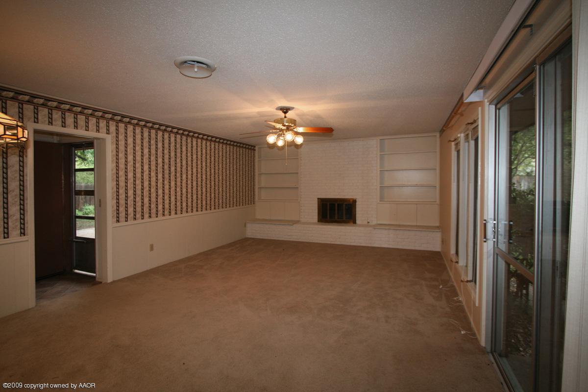 6706 Jameson Road Amarillo, TX 79106 - Photo 6 of 13 a view of a livingroom with a staircase