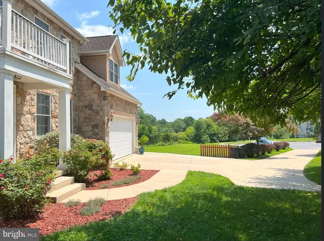 a view of a backyard with garden