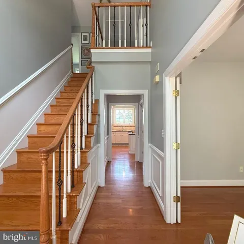 a view of an entryway with wooden floor