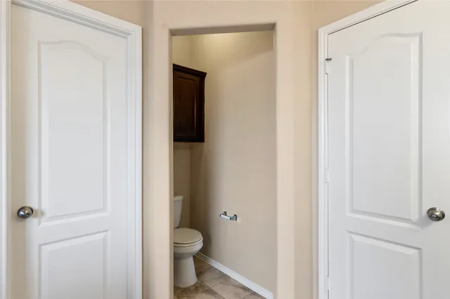 a bathroom with a toilet and a sink