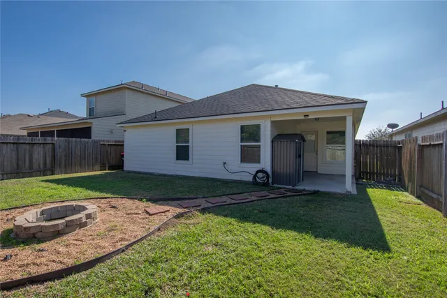 a view of a back yard of the house
