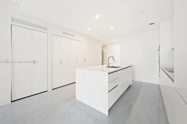 a bathroom with a sink a vanity and a mirror