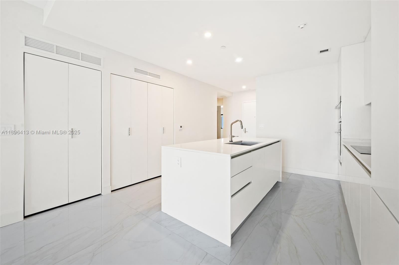700 Northeast 24th Street, Unit 702 Miami, FL 33137 - Photo 12 of 55 a bathroom with a sink a vanity and a mirror