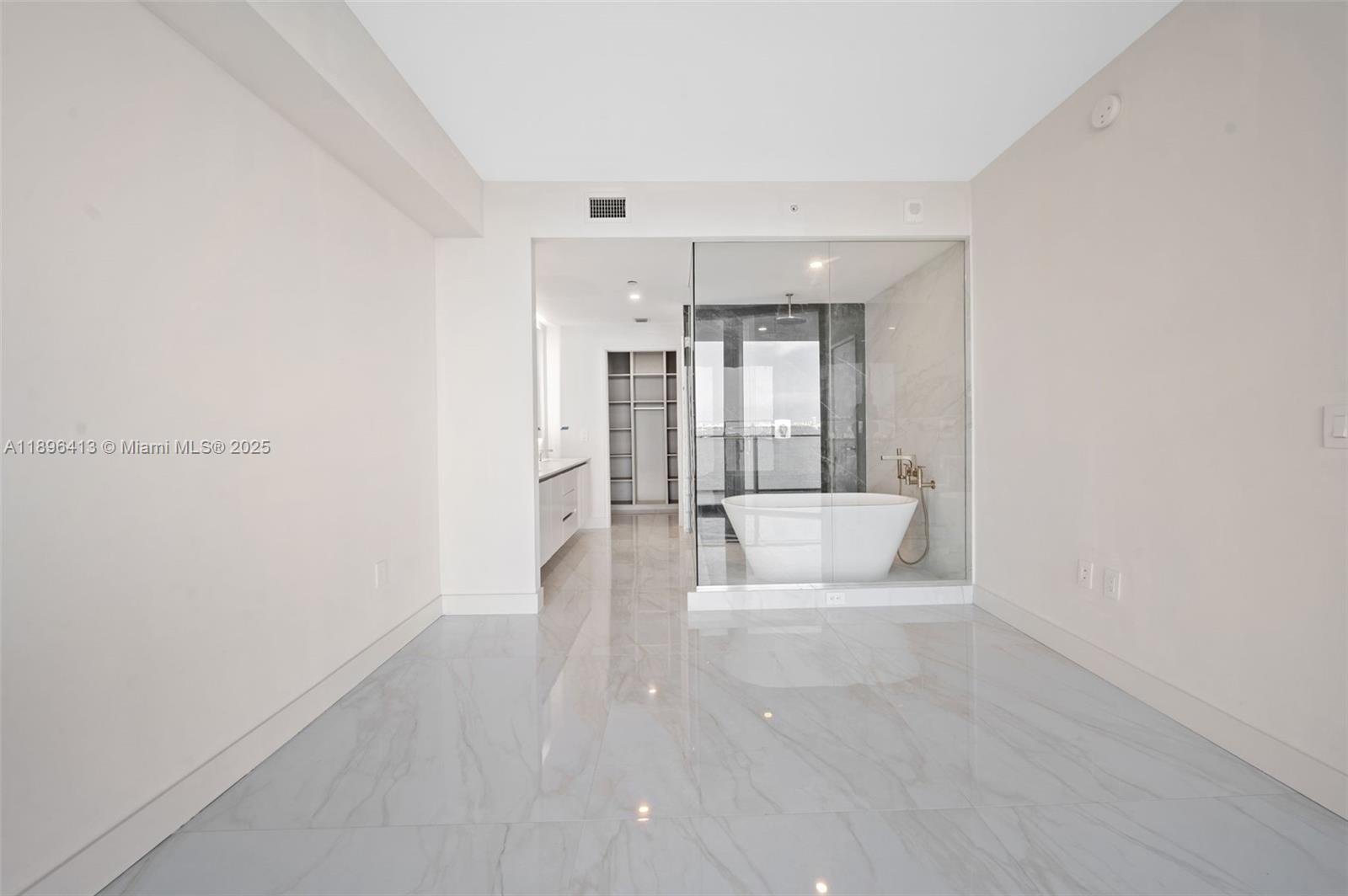 700 Northeast 24th Street, Unit 702 Miami, FL 33137 - Photo 16 of 55 a view of a big room with wooden floor and windows