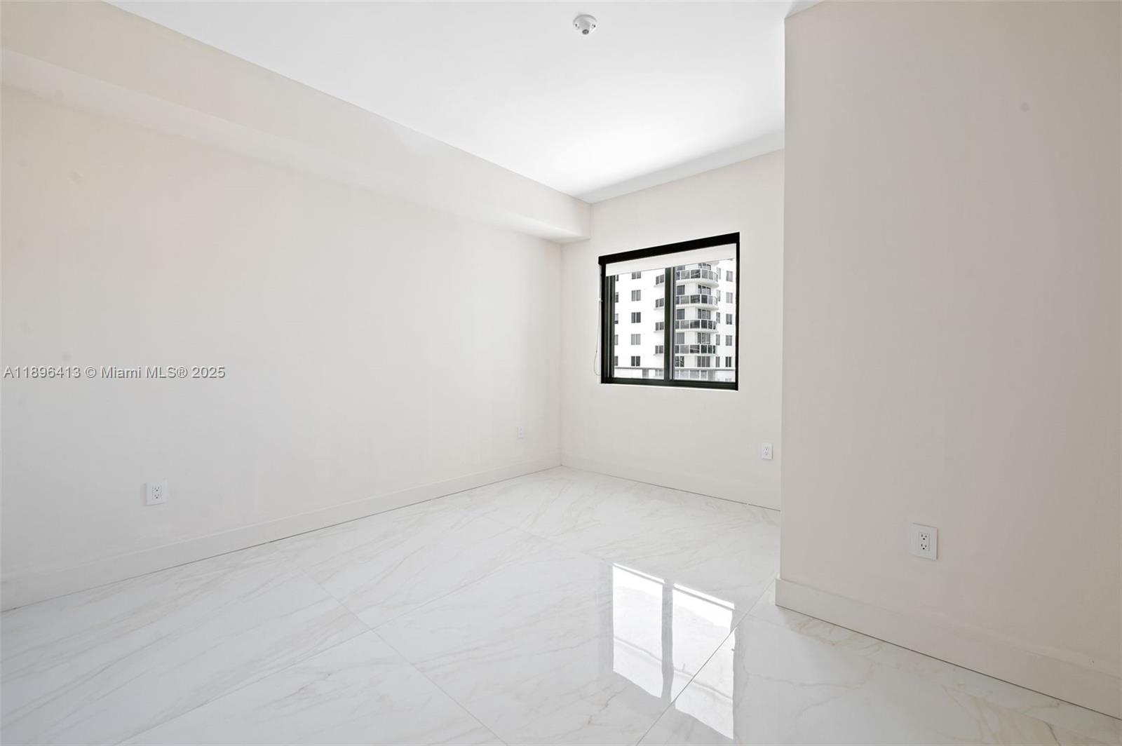 700 Northeast 24th Street, Unit 702 Miami, FL 33137 - Photo 21 of 55 an empty room with windows