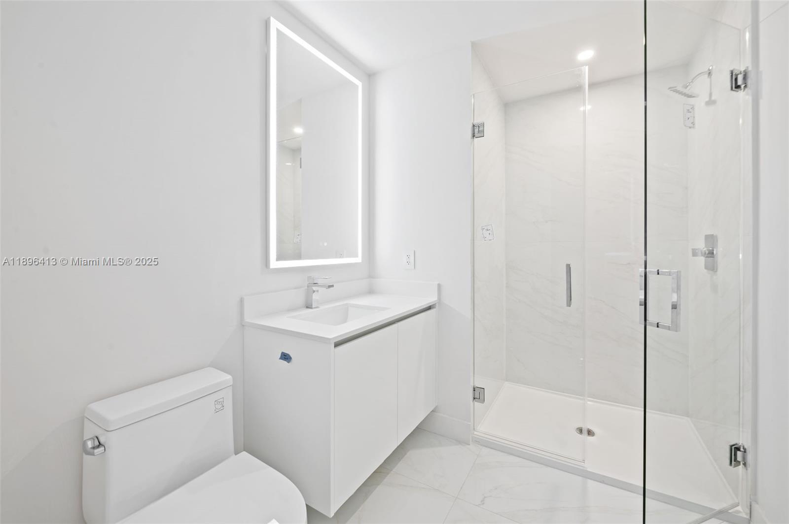 700 Northeast 24th Street, Unit 702 Miami, FL 33137 - Photo 23 of 55 a bathroom with a toilet sink and shower