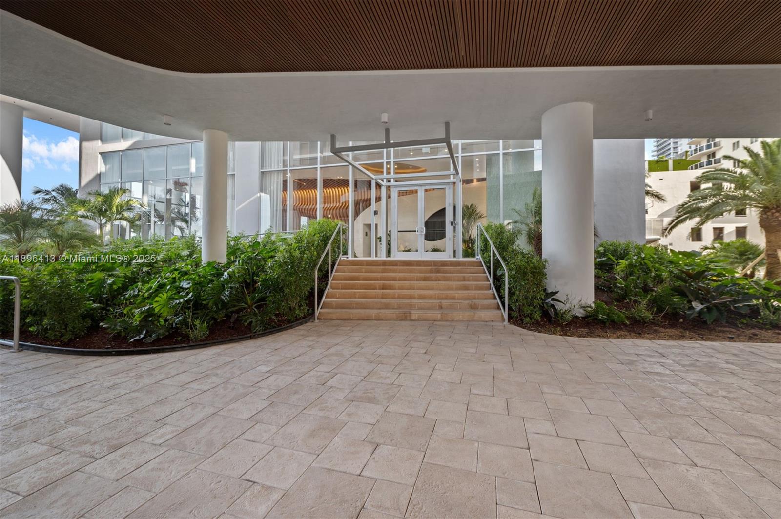 700 Northeast 24th Street, Unit 702 Miami, FL 33137 - Photo 30 of 55 a view of a building with potted plants