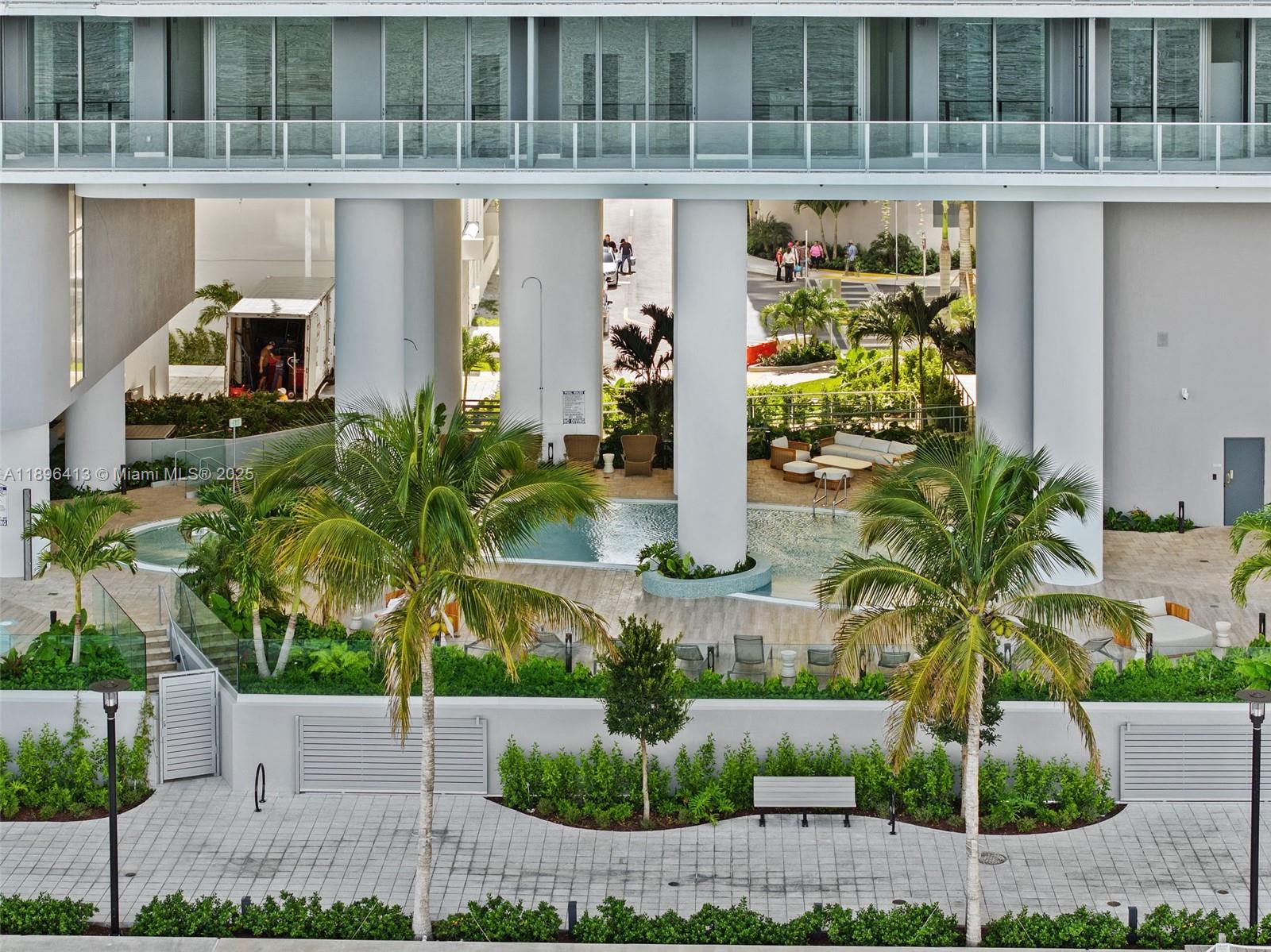 700 Northeast 24th Street, Unit 702 Miami, FL 33137 - Photo 4 of 55 a front view of a house with plants