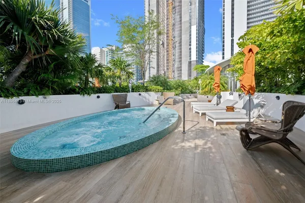 a view of a swimming pool with a patio