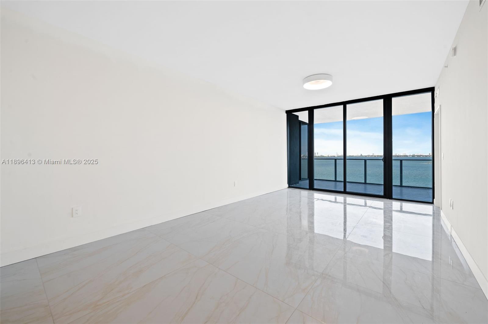 700 Northeast 24th Street, Unit 702 Miami, FL 33137 - Photo 8 of 55 a view of an empty room with a window