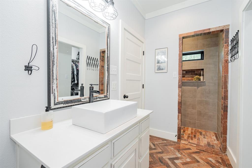 853 County Road 2215 Decatur, TX 76234 - Photo 14 of 39 Primary bathroom featuring vanity, a walk in shower, and ornamental molding