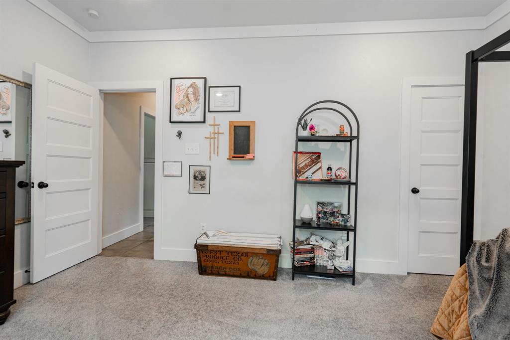 853 County Road 2215 Decatur, TX 76234 - Photo 17 of 39 Bedroom with light colored carpet and crown molding