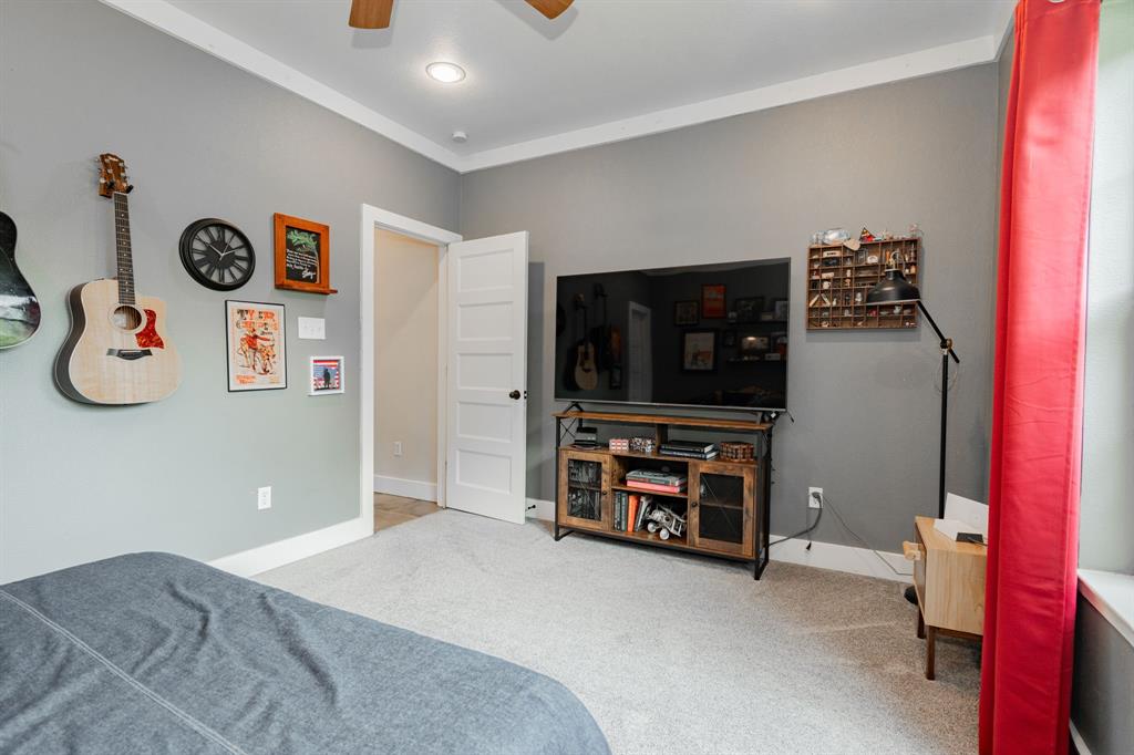 853 County Road 2215 Decatur, TX 76234 - Photo 21 of 39 Bedroom with light carpet and ceiling fan