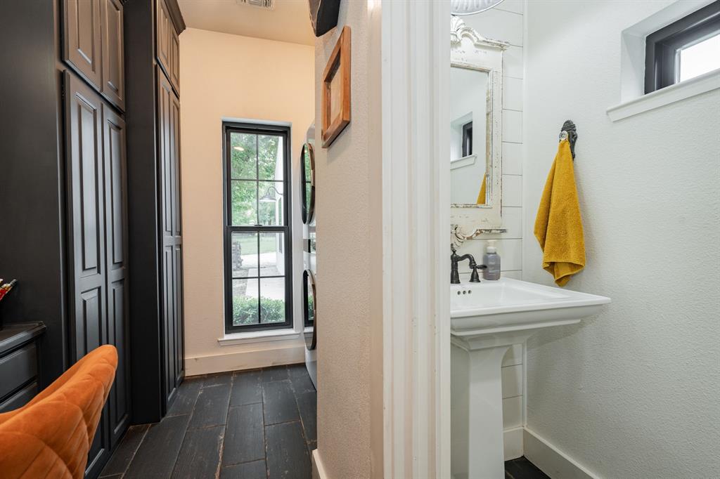 853 County Road 2215 Decatur, TX 76234 - Photo 23 of 39 Office/laundry with half bath featuring dark wood-style flooring and a textured wall