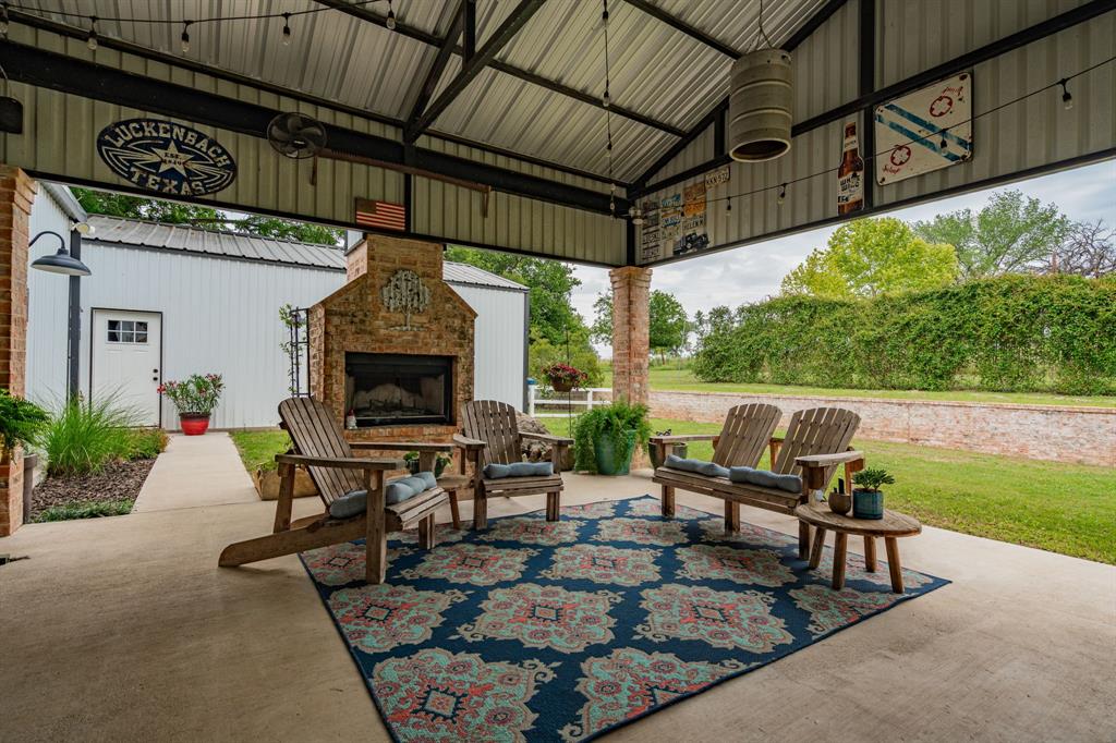 853 County Road 2215 Decatur, TX 76234 - Photo 25 of 39 View of patio with an outdoor living space with a fireplace