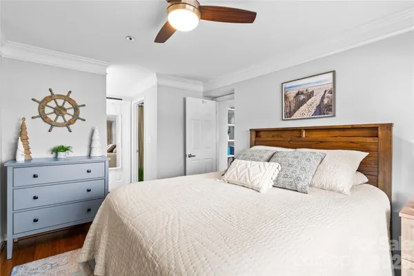 a bedroom with a bed and a dresser