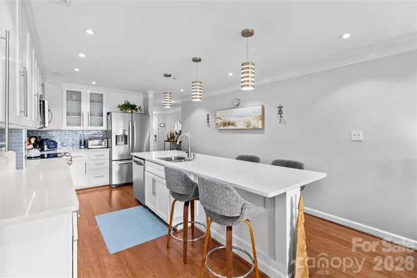 a kitchen with a table and chairs in it