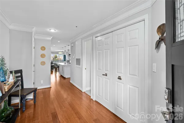 a view of a kitchen with wooden floor