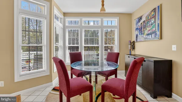 a living room with stainless steel appliances kitchen island granite countertop furniture and a kitchen view