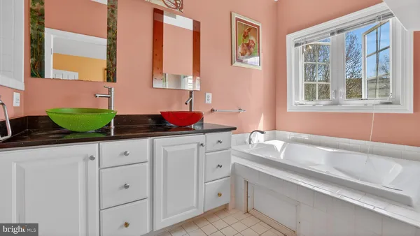 a view of bathroom with dual sinks