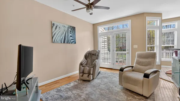 a view of living room with furniture and flat screen tv