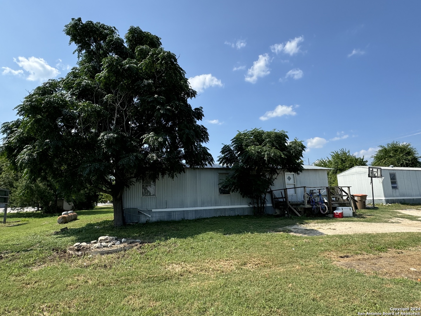 a backyard of a house with lots of green space