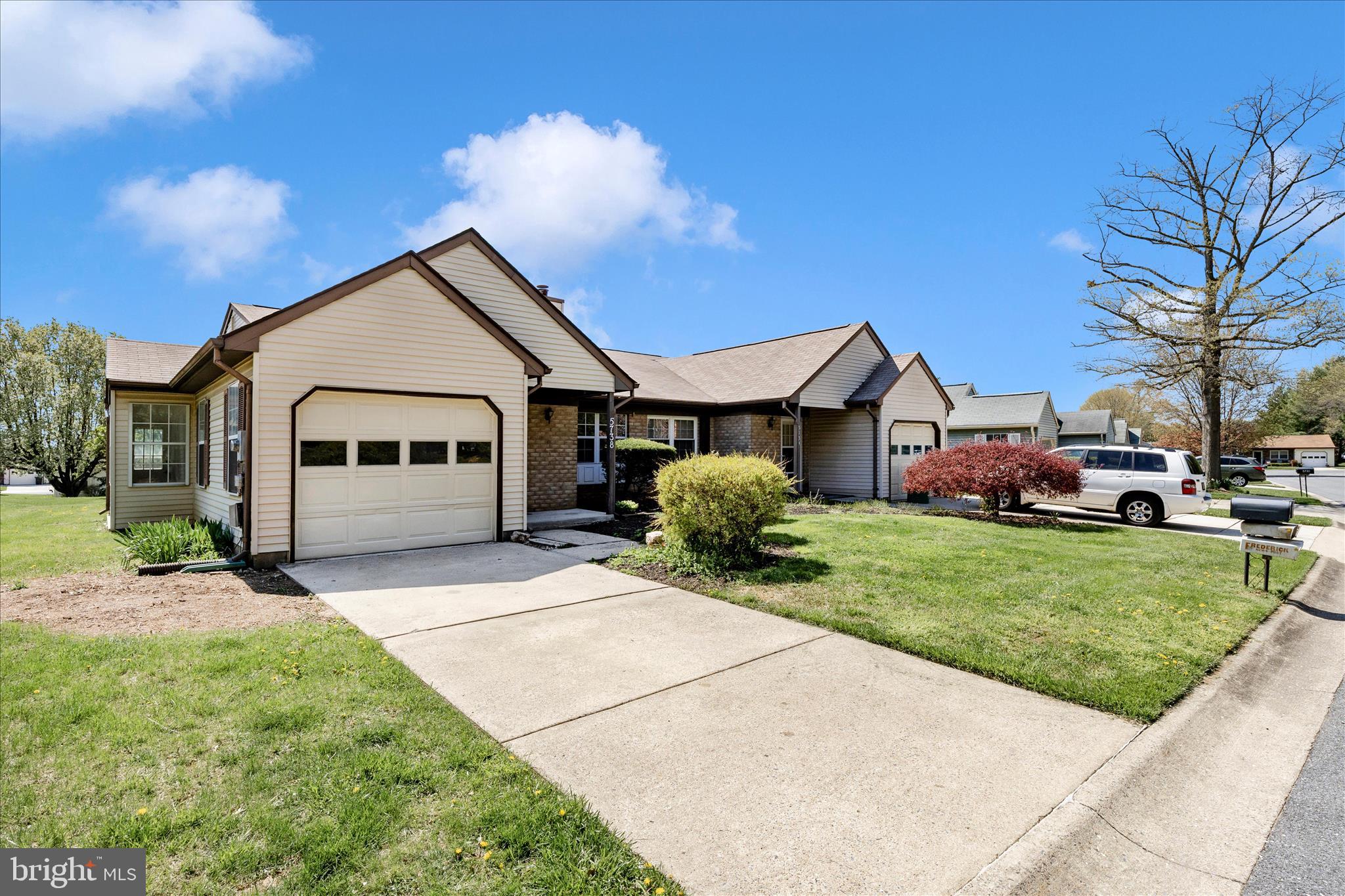 5738 Box Elder Court Frederick, MD 21703 - Photo 29 of 50 a front view of a house with a yard and garage