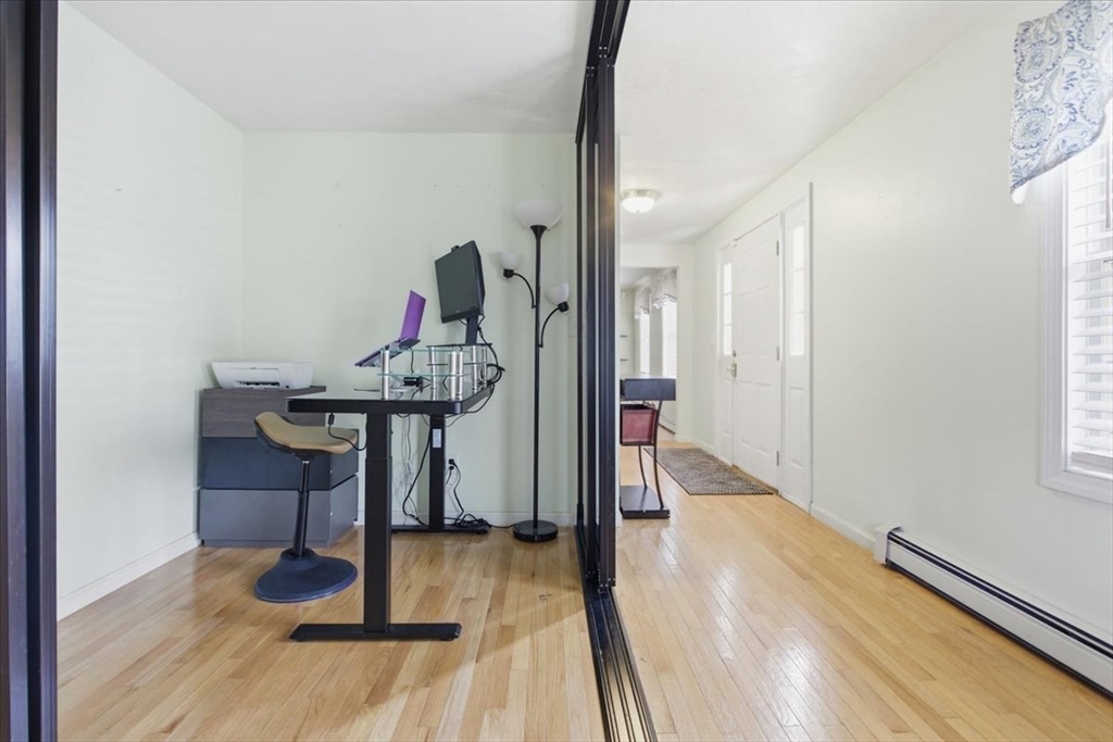 133 Grove Street Bellingham, MA 02019 - Photo 11 of 42 a view of entryway with wooden floor