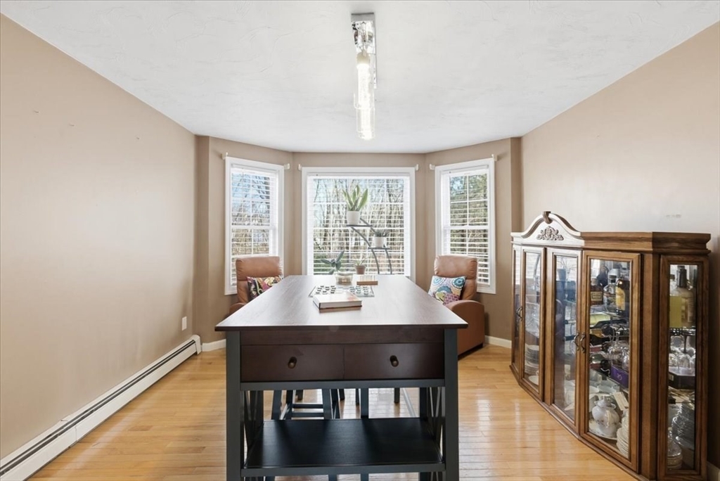133 Grove Street Bellingham, MA 02019 - Photo 13 of 42 a view of a dining room with furniture window and wooden floor