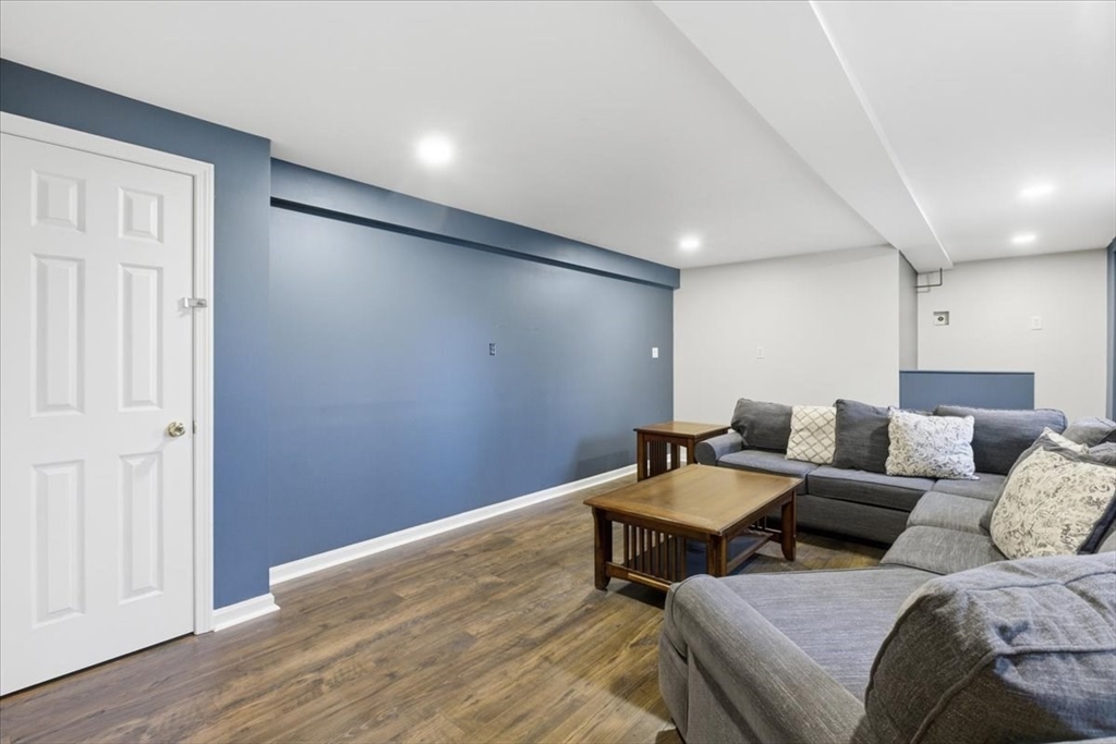 133 Grove Street Bellingham, MA 02019 - Photo 21 of 42 a living room with furniture and wooden floor