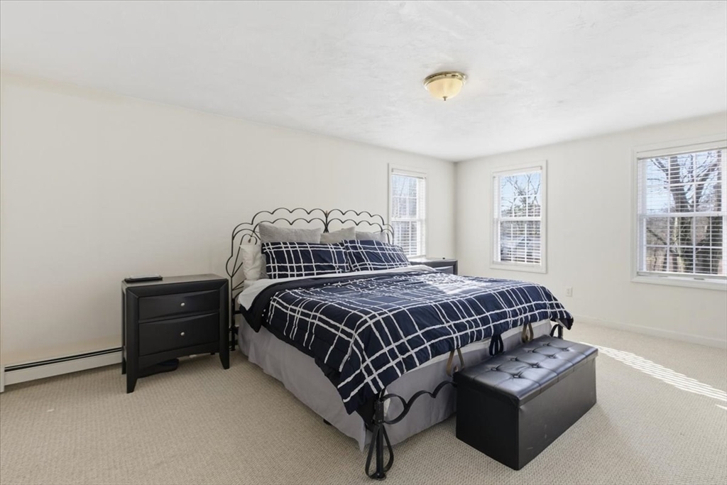 133 Grove Street Bellingham, MA 02019 - Photo 32 of 42 a bedroom with a bed and a window