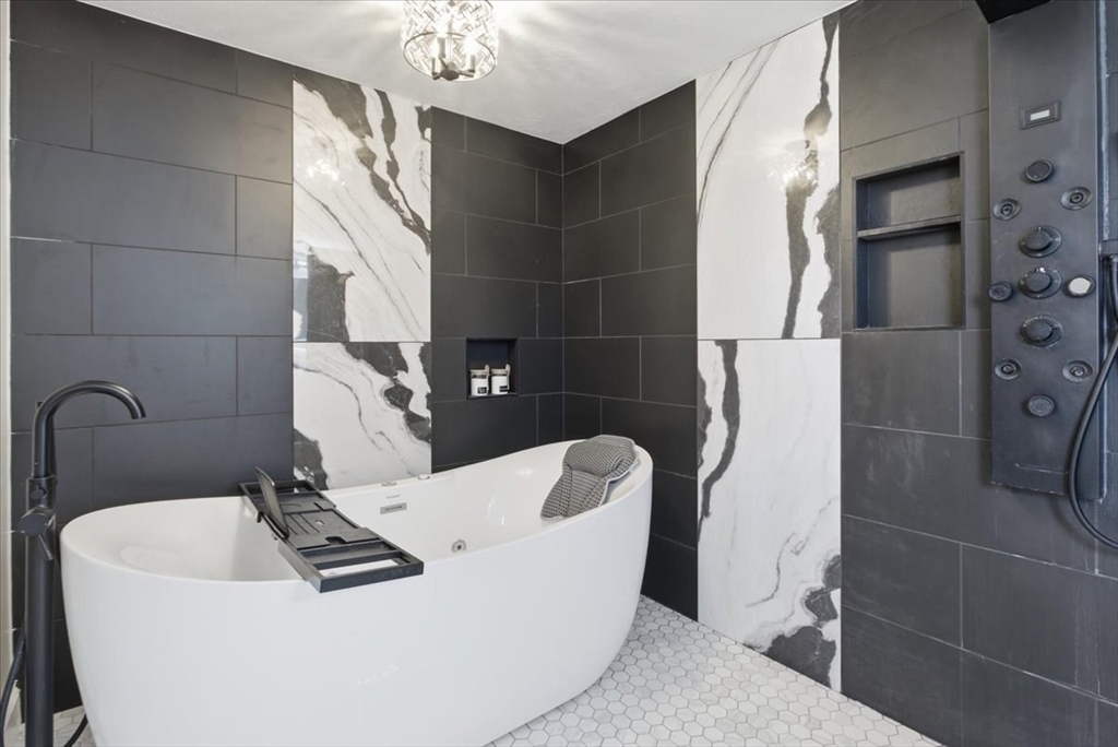 133 Grove Street Bellingham, MA 02019 - Photo 34 of 42 a bathroom with a sink a toilet and shower